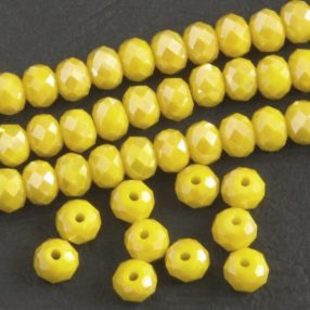   Üveg kristálygyöngy fazettált fánk kb. 4x6mm-es telt, kicsit zöldes sárga, AB