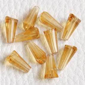   Üveg kristálygyöngy -  fazettált kúpos kb. 12x6mm-es melegsárga