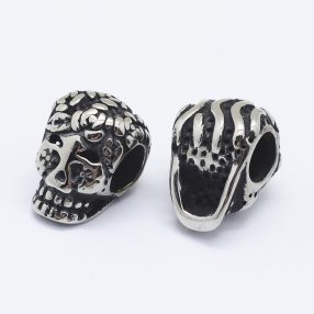   Antikolt nemesacél 9x13x9,5mm-es koponya köztes gyöngy - furat: 4,7mm