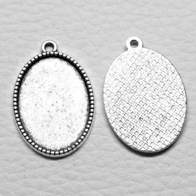   Tibeti stílusú ragasztható fém medál alap - antik ezüst színű 31x20mm-es, 25x18mm-es kabosonhoz